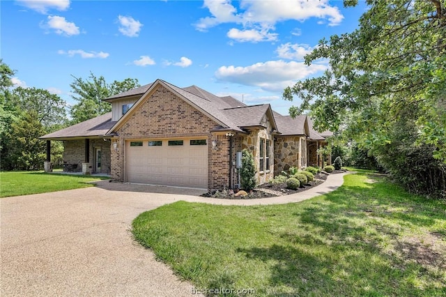 view of front of property with a garage and a front lawn