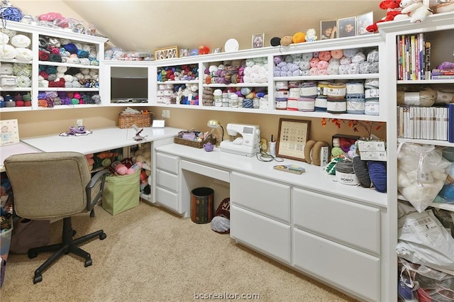 office space featuring light colored carpet and vaulted ceiling