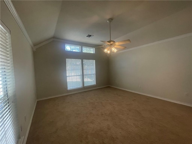 unfurnished room featuring vaulted ceiling, ceiling fan, ornamental molding, and carpet floors