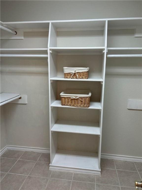 spacious closet with tile patterned flooring