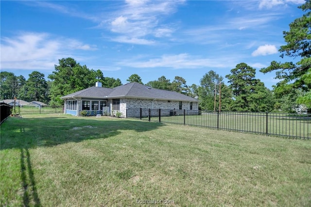 view of yard with a sunroom