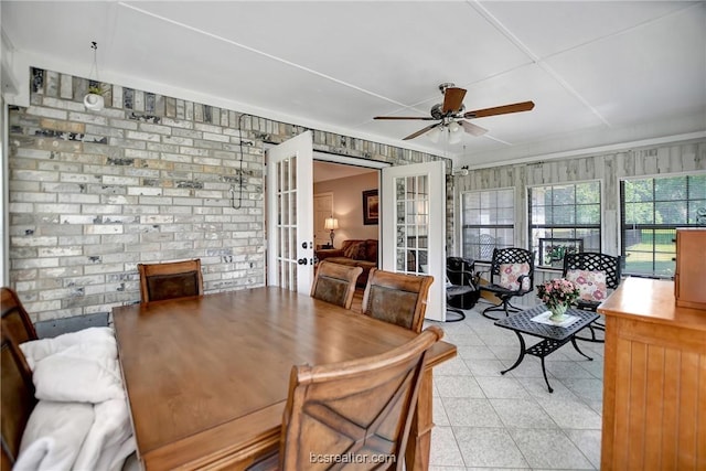 dining area with french doors and ceiling fan