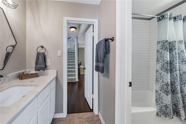 bathroom with shower / bath combo, vanity, and hardwood / wood-style flooring