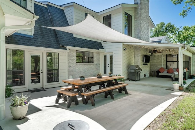 back of property featuring outdoor lounge area, french doors, ceiling fan, and a patio area