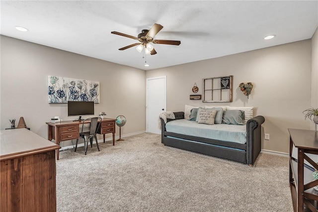 carpeted living room featuring ceiling fan