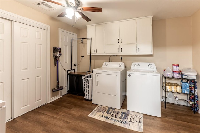 laundry area with cabinets, dark hardwood / wood-style flooring, ceiling fan, and washing machine and clothes dryer