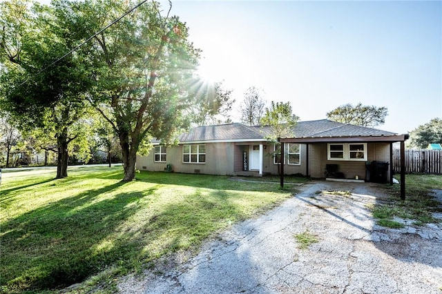 ranch-style house with a front lawn