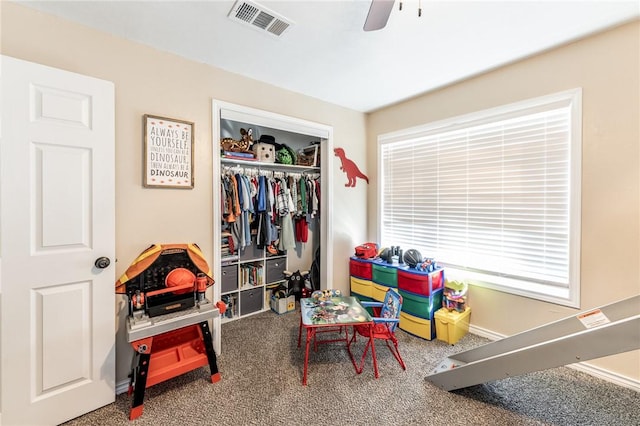 recreation room with ceiling fan and carpet floors