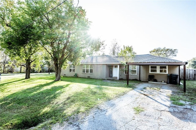 single story home featuring a front yard