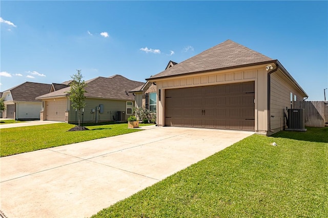 1969 Chief St, Bryan, TX 77807 - view of front of house featuring cooling unit, driveway, and a garage