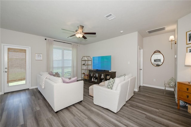 1969 Chief St, Bryan, TX 77807 - living room with wood finished floors, ceiling fan, and baseboards