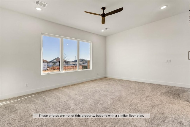 empty room featuring carpet and ceiling fan