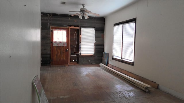 foyer entrance with ceiling fan and dark hardwood / wood-style floors