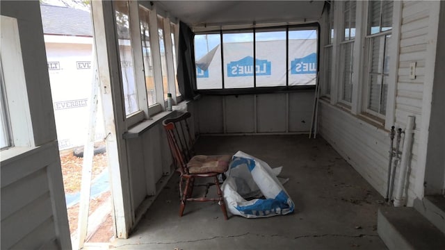 sunroom featuring vaulted ceiling