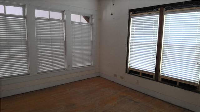 empty room featuring wood-type flooring