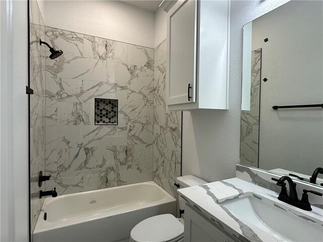 705 Waco St, Bryan, TX 77803 - full bathroom featuring vanity, a textured wall, and  shower combination