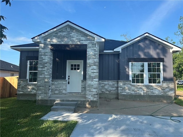 705 Waco St, Bryan, TX 77803 - ranch-style house with board and batten siding and brick siding