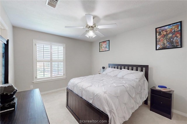 bedroom featuring ceiling fan and light carpet