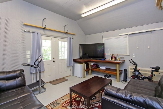 living room with lofted ceiling and french doors