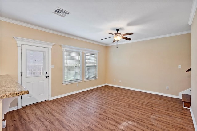 interior space featuring ornamental molding, ceiling fan, and hardwood / wood-style flooring