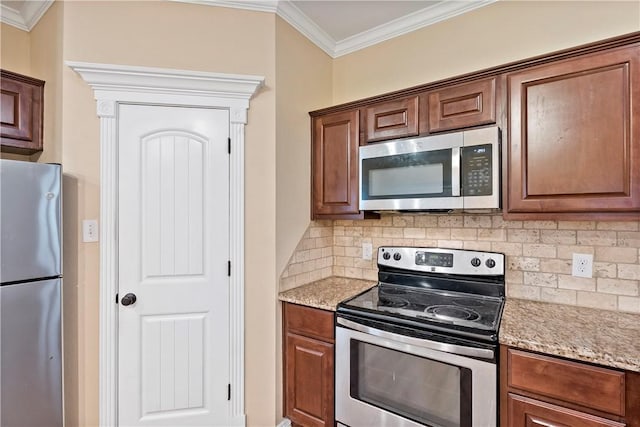 kitchen featuring stainless steel appliances, light stone counters, decorative backsplash, and crown molding