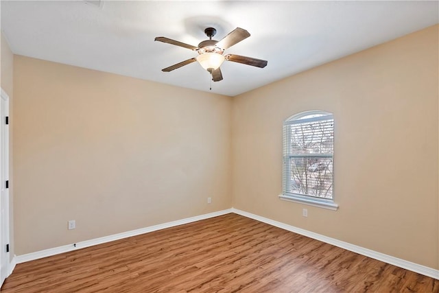 unfurnished room with light wood-type flooring and ceiling fan