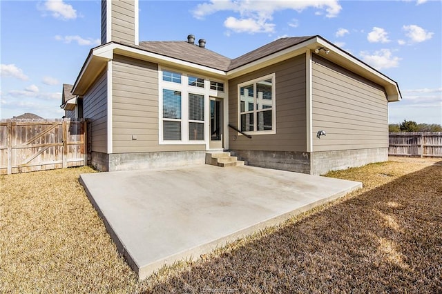 2025 Jester Trl, Bryan, TX 77807 - rear view of house featuring a patio area and a chimney