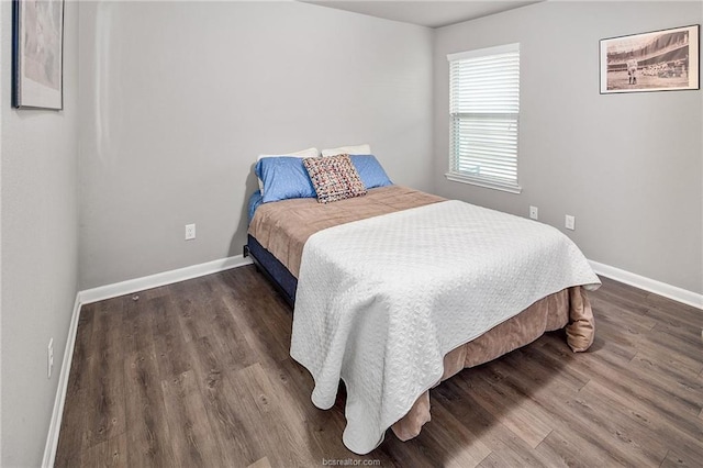 bedroom featuring dark wood-type flooring