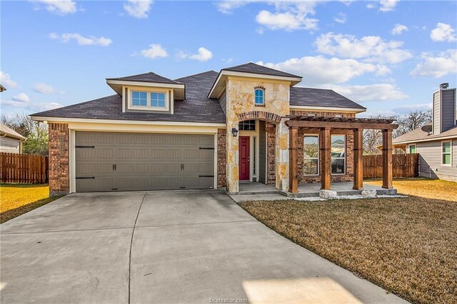 2025 Jester Trl, Bryan, TX 77807 - view of front of house with driveway, a pergola, an attached garage, brick siding, and stone siding