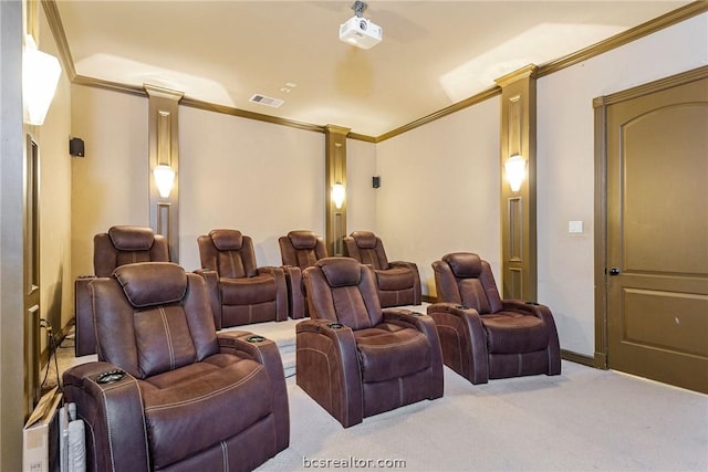 cinema featuring ornate columns, light carpet, and crown molding