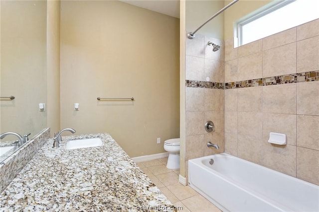 full bathroom with tile patterned floors, vanity, toilet, and tiled shower / bath