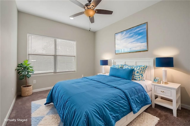 bedroom with dark carpet and ceiling fan