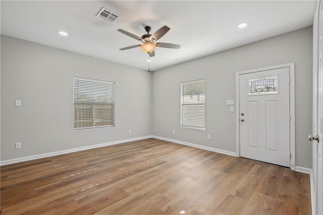 entryway with hardwood / wood-style flooring and ceiling fan