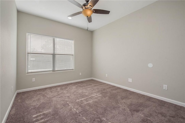 carpeted spare room with ceiling fan