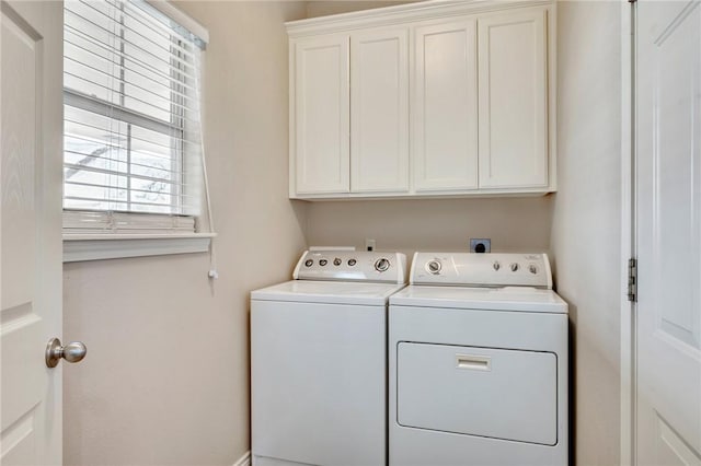 laundry room with cabinet space and independent washer and dryer
