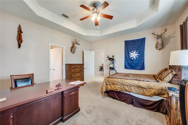 bedroom featuring light carpet, visible vents, a raised ceiling, a ceiling fan, and ornamental molding