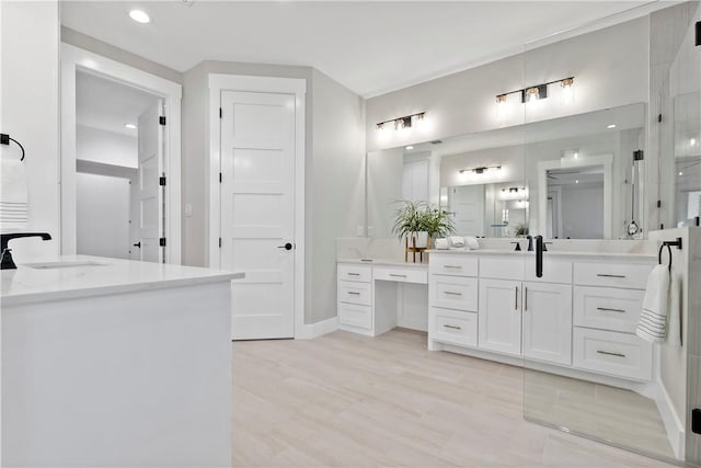 bathroom featuring vanity and wood-type flooring