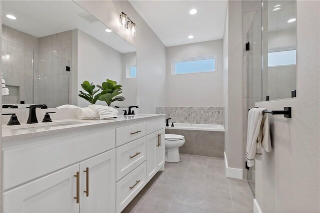 full bathroom with independent shower and bath, vanity, tile patterned flooring, and toilet