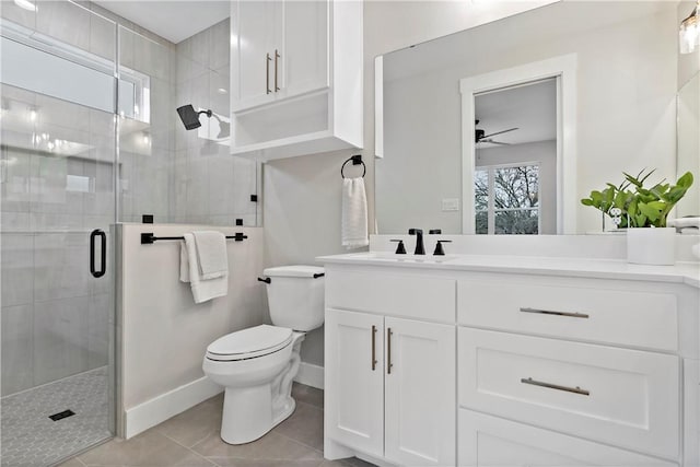 bathroom with plenty of natural light, toilet, a shower with shower door, and vanity