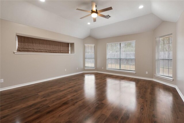 empty room featuring recessed lighting, a ceiling fan, vaulted ceiling, wood finished floors, and baseboards