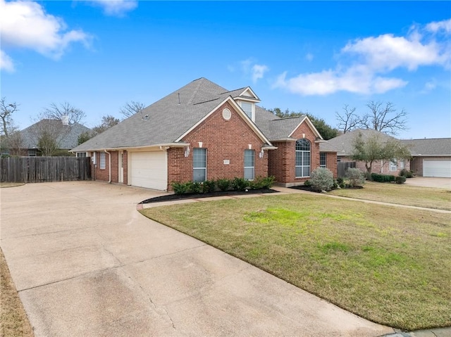 traditional home featuring driveway, a garage, brick siding, fence, and a front yard