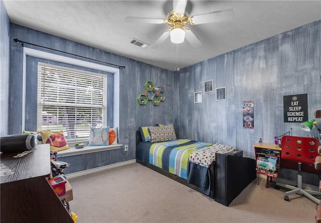 carpeted bedroom featuring ceiling fan