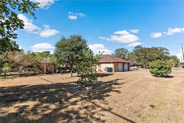 view of yard with a garage