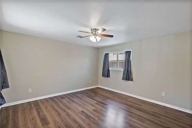 unfurnished room featuring ceiling fan and dark wood-type flooring