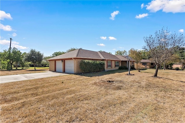 single story home featuring a garage and a front yard