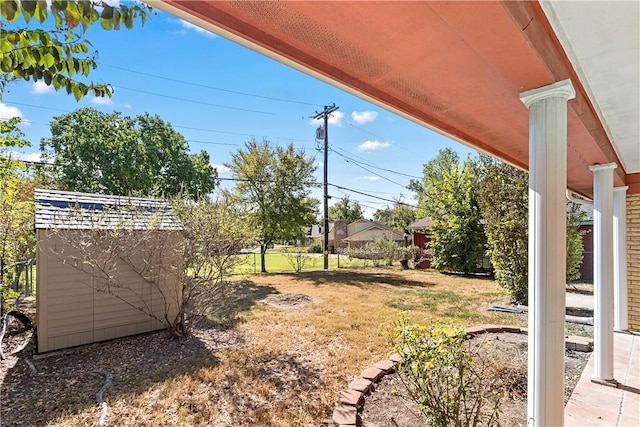 view of yard with a storage shed