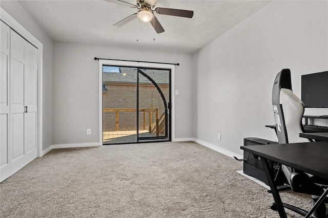 office area with ceiling fan and carpet