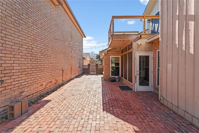 view of side of property with a patio