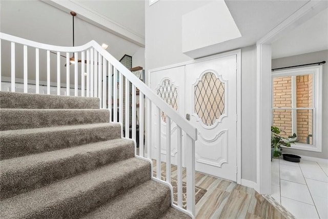 stairway featuring wood-type flooring