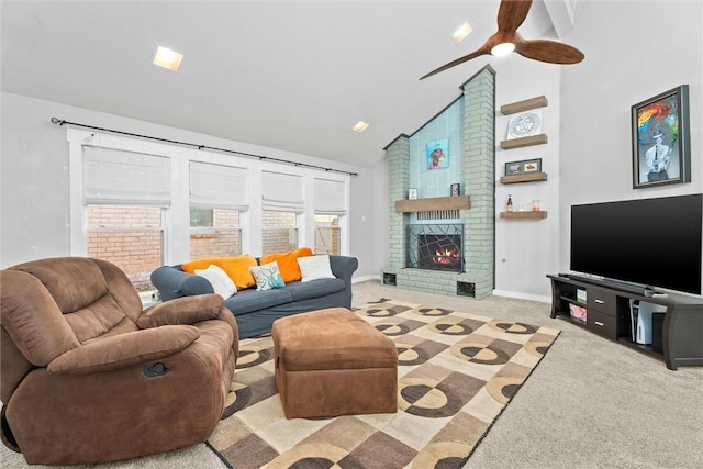 carpeted living room featuring ceiling fan, high vaulted ceiling, and a fireplace